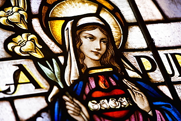 Close-up of Virgin Mary on a stained glass window