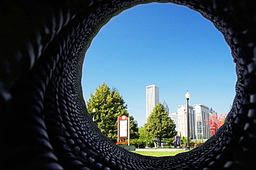 Skyscrapers viewed through a hole in a wall, Gateway Park, Chicago, Illinois, USA