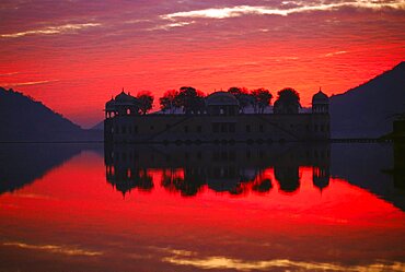 Reflection of a city palace in the lake, Jalmahal Lake, Jaipur, Rajasthan, India