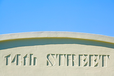Close-up of a street name carved on the wall