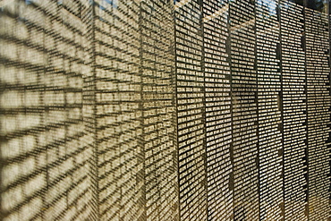 Close-up of text on a memorial wall