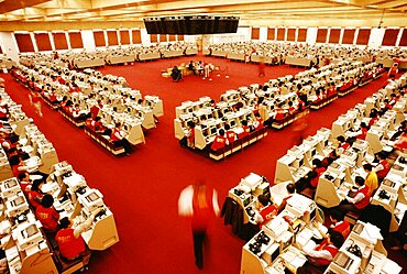 Businessmen and businesswomen working at a stock exchange, Hong Kong, China