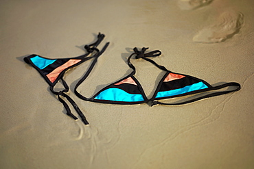Close-up of a bikini on the beach