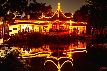 Building lit up at night, Master of the Nets Garden, Suzhou, China