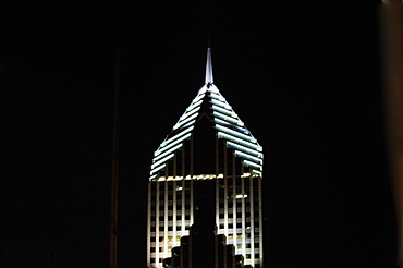 Low angle view of the top of a building lit up at night, Prudential Tower, Chicago, Illinois, USA