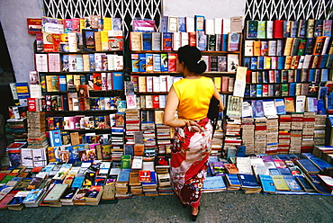 Rear view of a woman standing at bookstall, Yangon, Myanmar