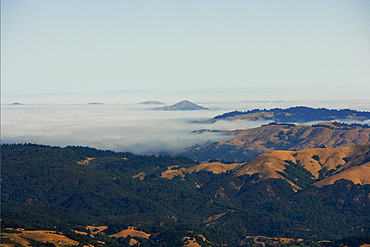 High angle view of clouds over mountains