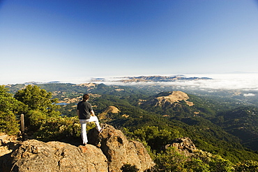 High angle view of a man standing on a hilltop