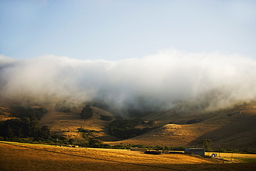 Clouds rolling over a hill range