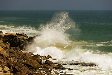 Waves crashing against rocks in the sea