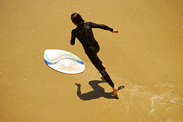 High angle view of a boogie boarder on the beach