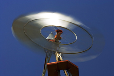 Low angle view of an industrial windmill