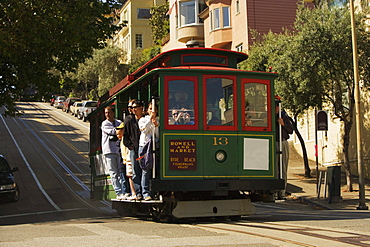 Low angle view of group of people in a cable car, San Francisco, California, USA