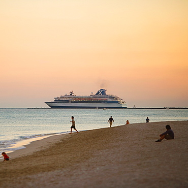 Tourist on the beach at dusk