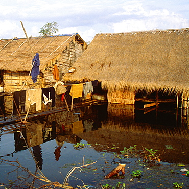 Huts in a flooded village, Siem Reap, Cambodia