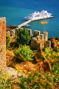 High angle view of a fort with a cruise ship docked near a jetty, Alanya, Turkey