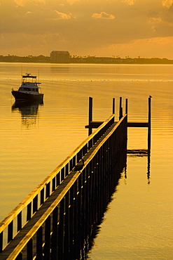 Pier and a boat in the sea, St. Augustine Beach, Florida, USA