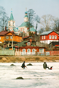 Two people fishing on ice, Zagorsk, Russia