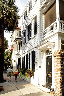 Rear view of a man and a woman walking on the street, Charleston, South Carolina, USA