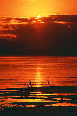 Silhouette of two people on the beach, Suva, Fiji