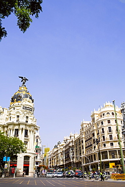 Buildings along a road in a city, Metropolis Building, Madrid, Spain