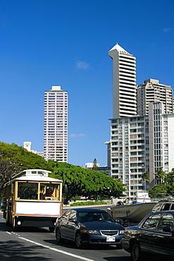 Traffic on the road with skyscrapers in the background, Honolulu, Oahu, Hawaii Islands, USA