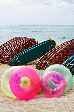 Inflatable rings and surfboards on the beach, Waikiki Beach, Honolulu, Oahu, Hawaii Islands, USA