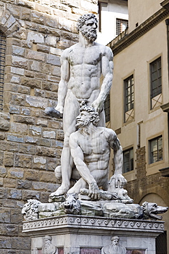 Naked statues in front of a brick wall, Hercules and Caco, Piazza della Signoria, Florence, Italy