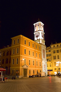 Low angle view of buildings lit up at night, Nice, France