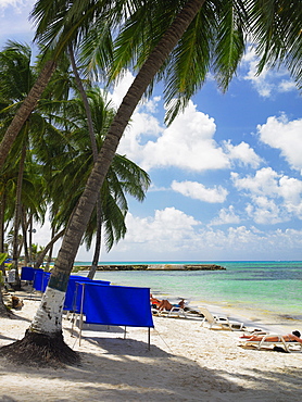 Tourists sunbathing on the beach, Spratt Bight Beach, San Andres, Providencia y Santa Catalina, San Andres y Providencia Department, Colombia