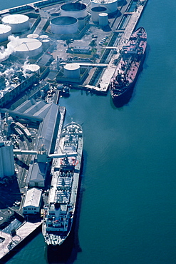 Aerial shot of ships at an oil refinery