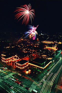 Aerial view of buildings in a city lit up at night, Tivoli Gardens, Copenhagen, Denmark