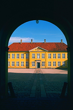 Facade of a palace viewed through an archway, Roskilde Palace, Roskilde, Denmark