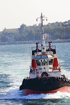 Tugboat moving in a river, Athens, Greece