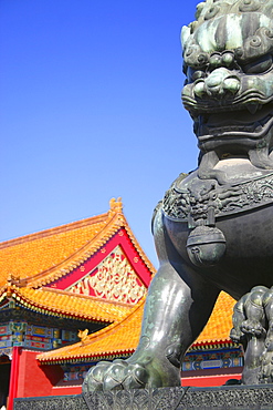 Low angle view of the statue of a lion in front of a palace, Forbidden City, Beijing, China