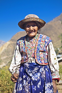 Portrait of a senior woman holding a cane and standing, Coshnirua, Peru