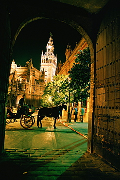 Low angle view of a tower light up at night, Seville, Spain