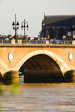 Arch bridge across a river, Pont De Pierre, St. Michel Basilica, Garonne River, Bordeaux, Aquitaine, France