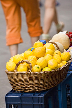 Close-up of lemons in a wicker basket at a market stall, Italian Riviera, Cinque Terre National Park, Vernazza, La Spezia, Liguria, Italy