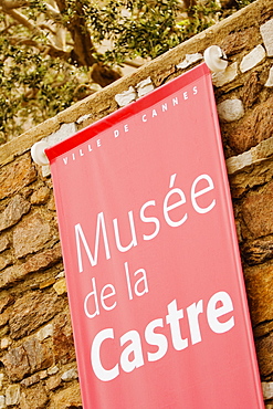 Close-up of a banner hanging on a stone wall, Musee De La Castre, Cote d'Azur, Cannes, Provence-Alpes-Cote D'Azur, France