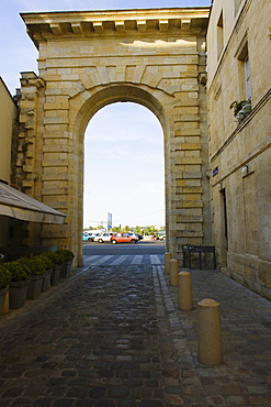 Traffic on road viewed through an arch, Porte de la Monnaie, Vieux Bordeaux, Bordeaux, France