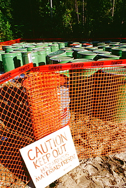 Warning sign in front of barrels of toxic waste, Virginia, USA