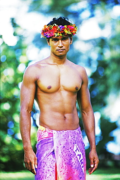 Portrait of a young man wearing a sarong, Hawaii, USA