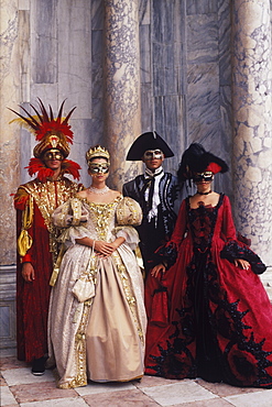 Two men and two women wearing costumes, Venice, Veneto, Italy