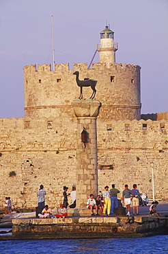 Group of people standing near a column