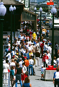 Tourists along Fisherman’s Wharf in San Francisco, California