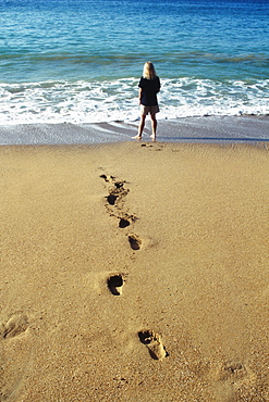 A woman's footprints imprinted on the sand, Pigeon Point Beach, Tobago, Caribbean