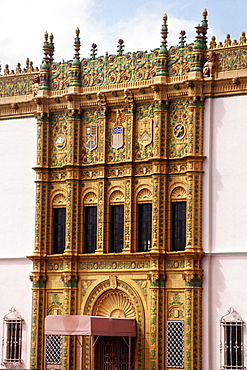 Side view of a pink building adorned with artwork, San Juan, Puerto Rico