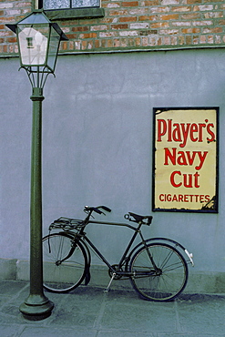 Close-up of a bicycle leaning against a wall, Republic of Ireland