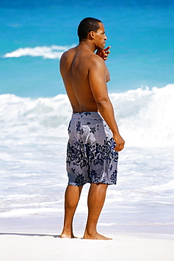 Rear view of man in trunks, Horse-shoe Bay beach, Bermuda